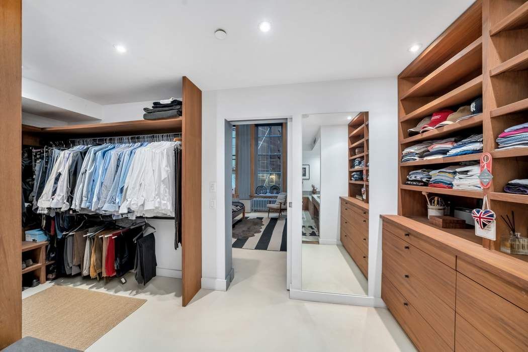 876 Broadway, Unit 3 Manhattan, NY 10003 - Photo 10 of 13 a view of walk in closet with clothes and shoes