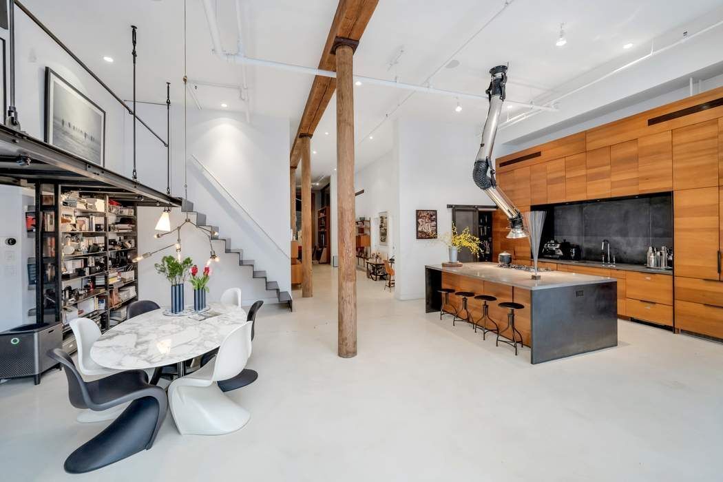 876 Broadway, Unit 3 Manhattan, NY 10003 - Photo 3 of 13 a living room with furniture and a fireplace