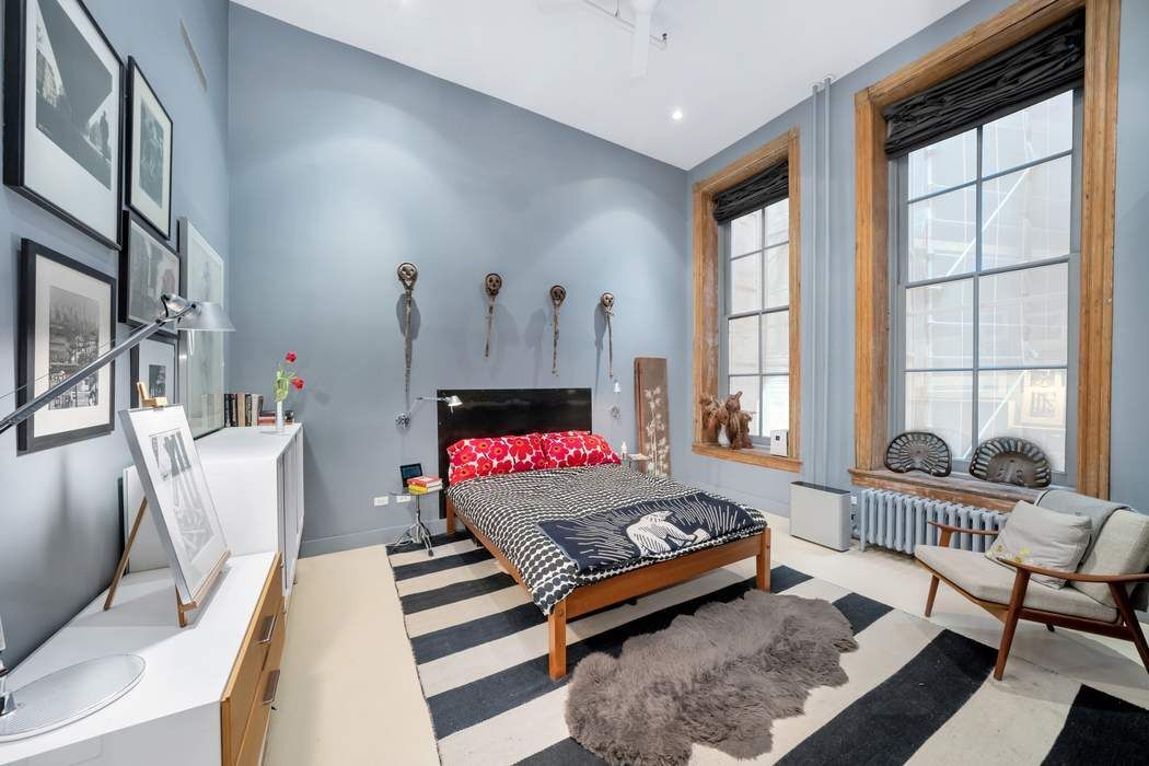 876 Broadway, Unit 3 Manhattan, NY 10003 - Photo 8 of 13 a bedroom with furniture and a window