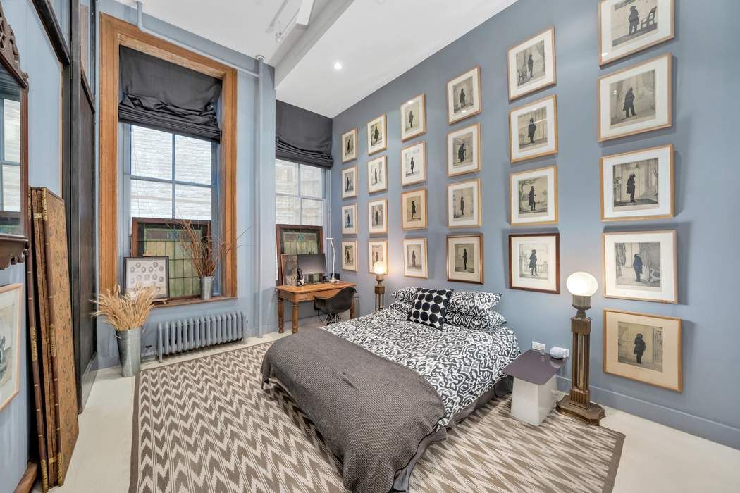 876 Broadway, Unit 3 Manhattan, NY 10003 - Photo 9 of 13 a bedroom with furniture and a window