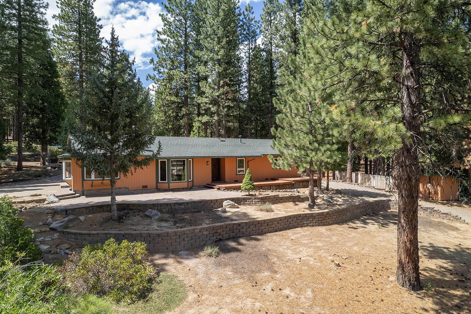 99 Catfish Lane Calpine, CA 96124 - Photo 2 of 21 a front view of a house with a yard and trees