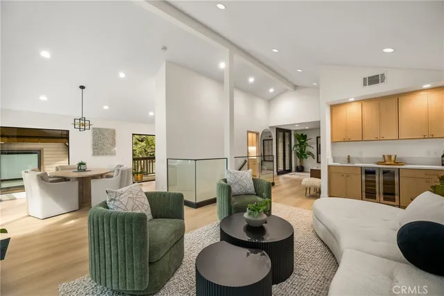 a living room with furniture a rug and a fireplace