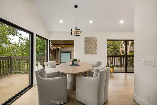 a living room with furniture a large window with outer view