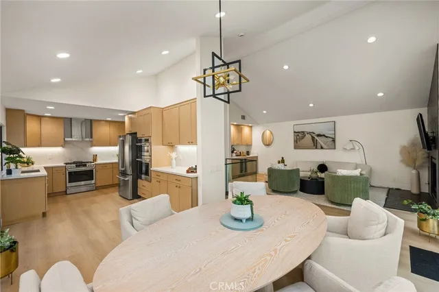 a kitchen with a refrigerator and a sink