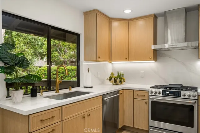 a kitchen with stainless steel appliances a stove and a refrigerator