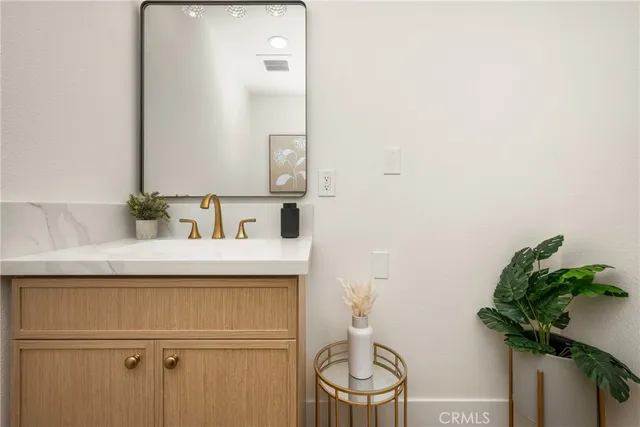 a bedroom with a bed lamp and window