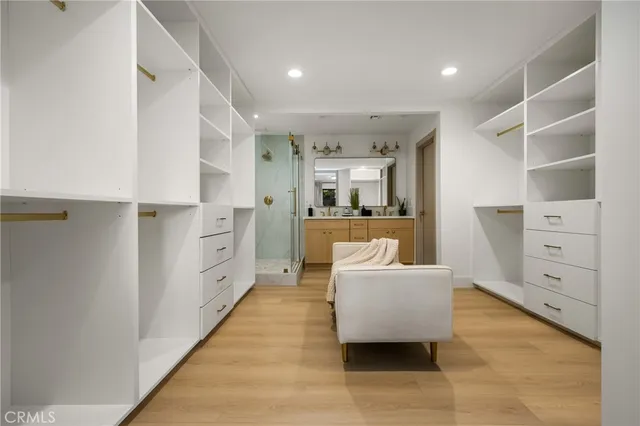 a bathroom with a double vanity sink mirror and shower