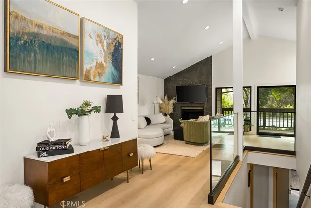 a view of living room with furniture and a flat screen tv