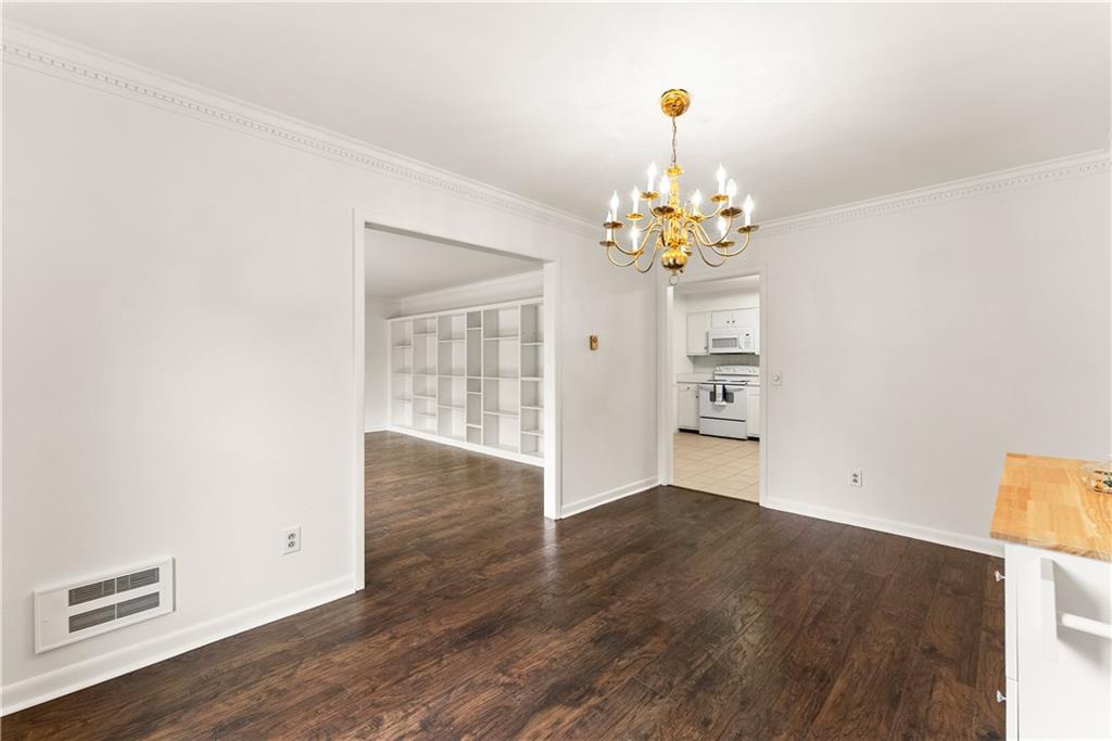 1002 Dixon Drive Gainesville, GA 30501 - Photo 11 of 37 wooden floor in an empty room with a window