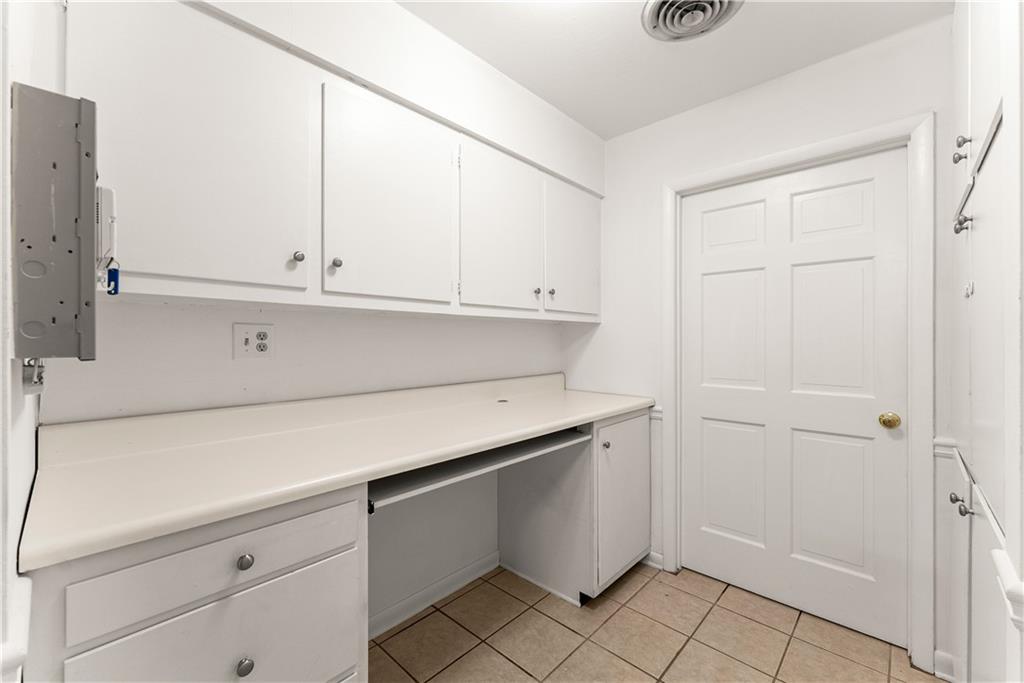 1002 Dixon Drive Gainesville, GA 30501 - Photo 17 of 37 a view of cabinets and utility room in back