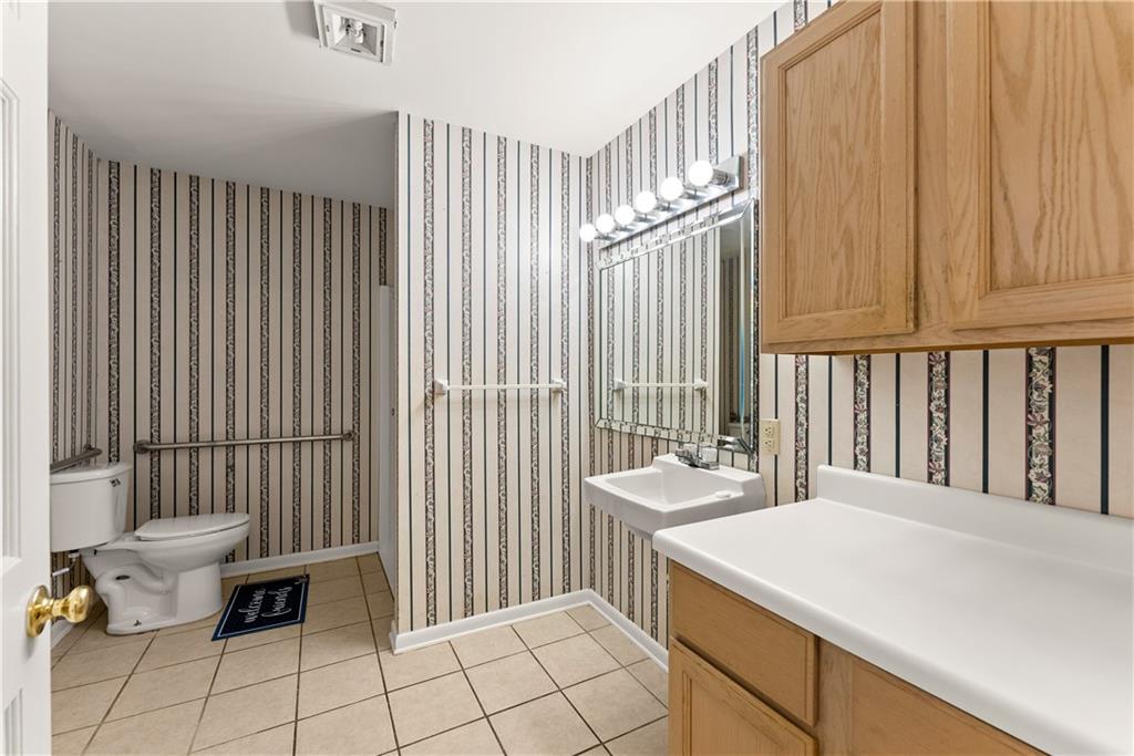 1002 Dixon Drive Gainesville, GA 30501 - Photo 18 of 37 a bathroom with a sink and a mirror
