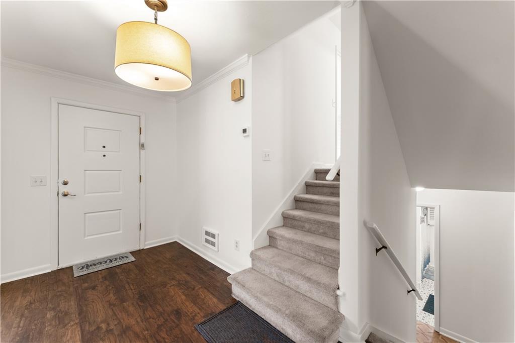 1002 Dixon Drive Gainesville, GA 30501 - Photo 24 of 37 an empty room with wooden floor and windows