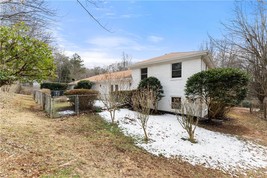 1002 Dixon Drive Gainesville, GA 30501 - Photo 26 of 37 a view of a house with backyard and sitting area