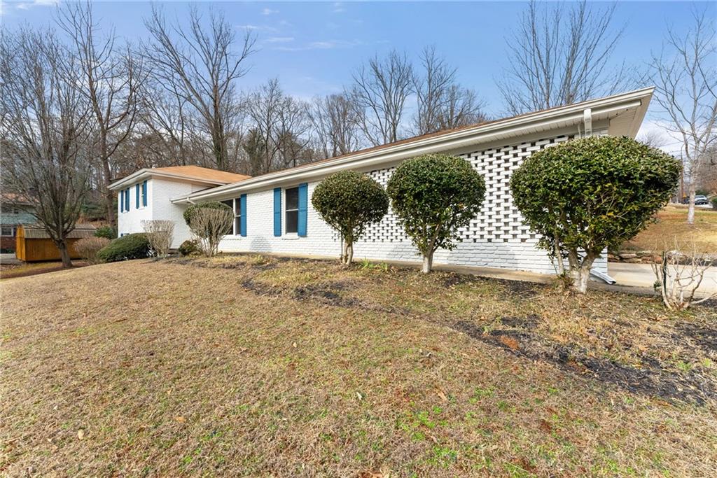 1002 Dixon Drive Gainesville, GA 30501 - Photo 34 of 37 a front view of a house with a yard
