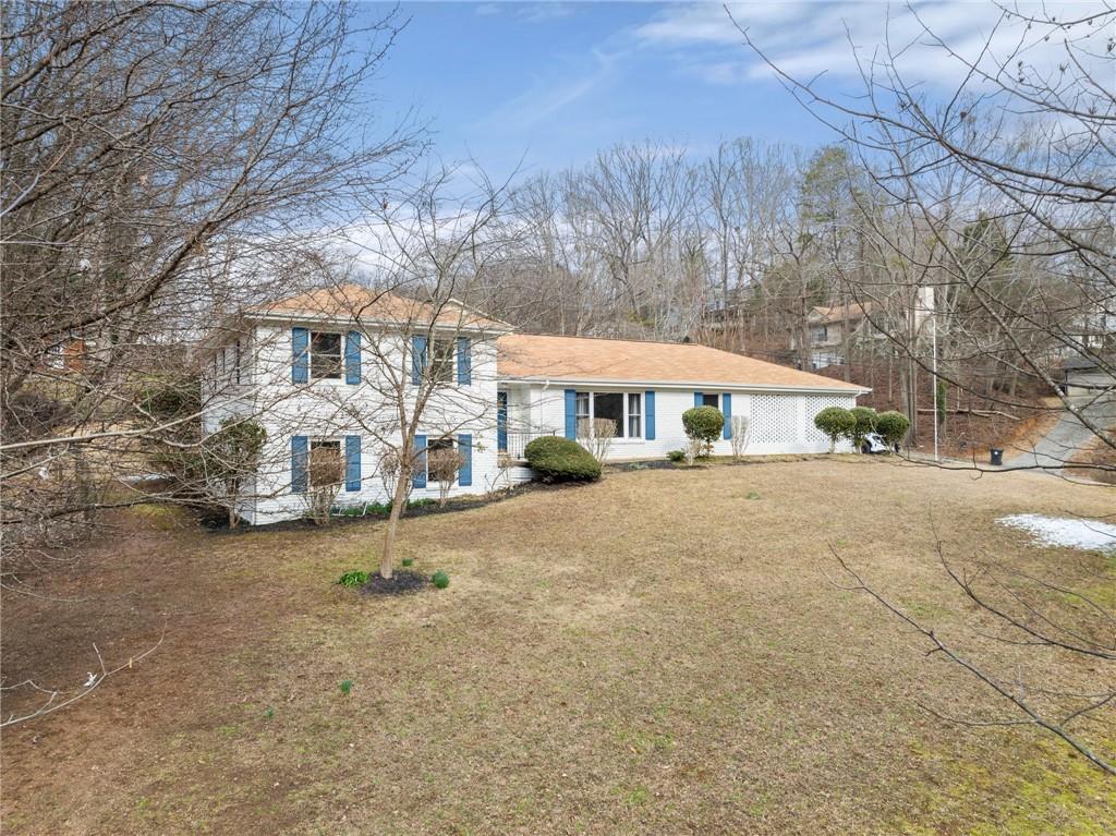 1002 Dixon Drive Gainesville, GA 30501 - Photo 6 of 37 a front view of a house with a yard and garage