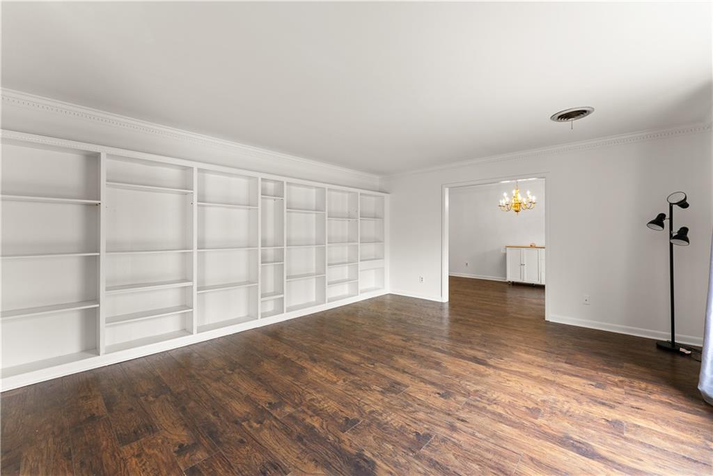 1002 Dixon Drive Gainesville, GA 30501 - Photo 8 of 37 wooden floor in an empty room with a window