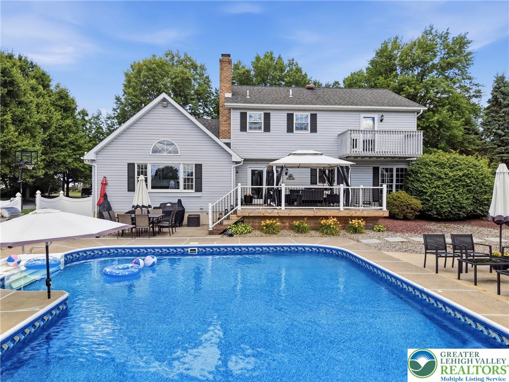 890 Lahr Road Nazareth, PA 18064 - Photo 47 of 71 An inviting backyard oasis offers a sparkling in-ground pool and spacious deck for entertaining.