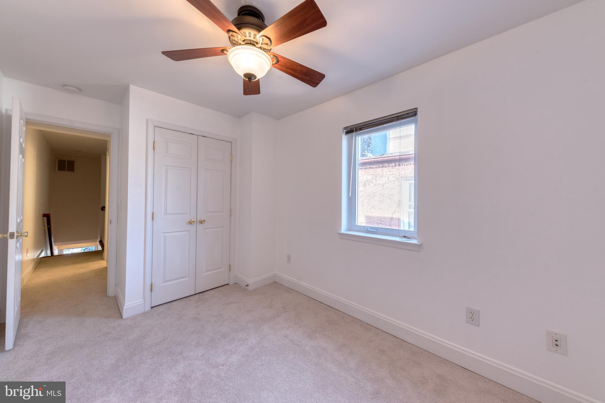 1818 Bank Street Baltimore, MD 21231 - Photo 16 of 20 an empty room with fan and windows