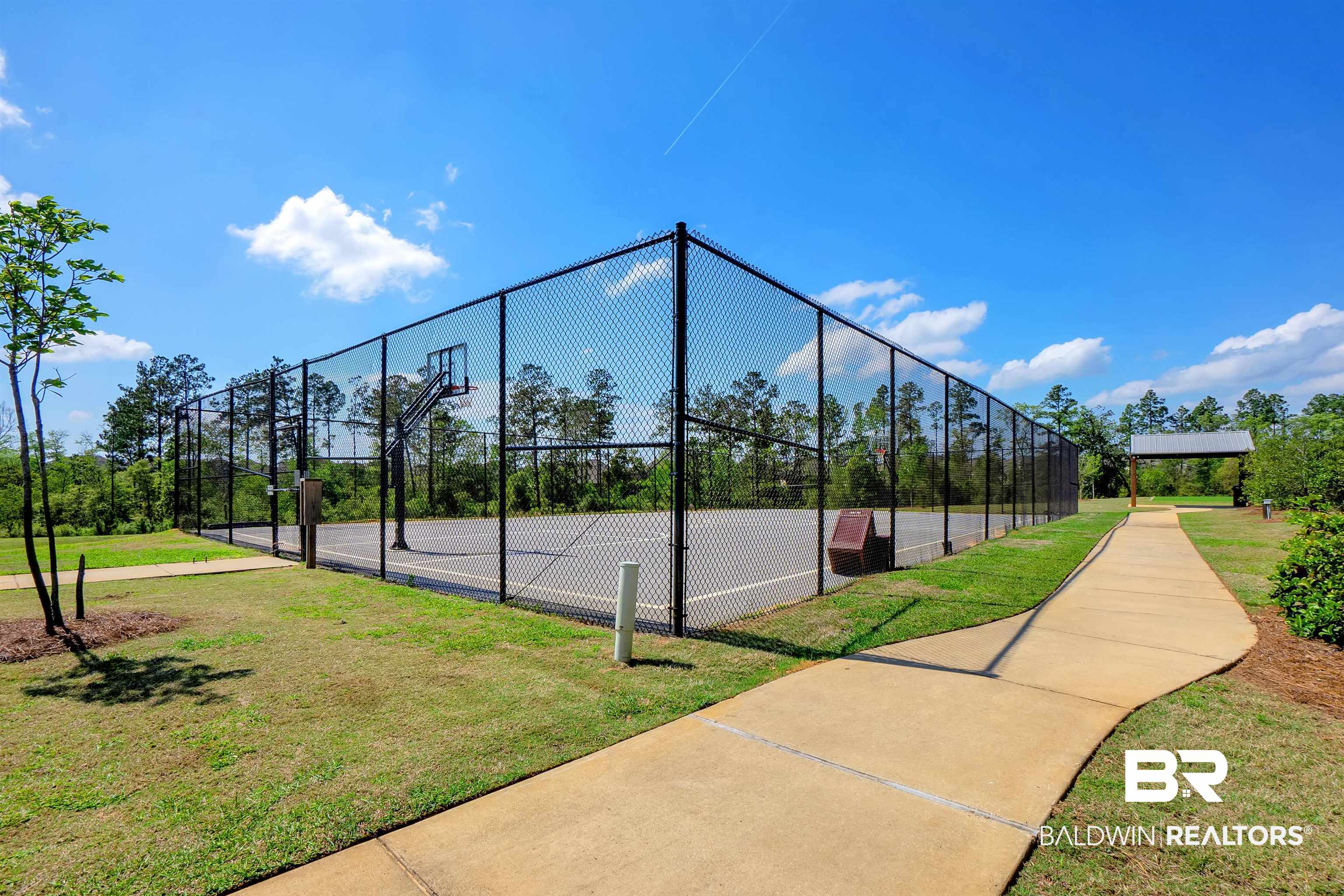 31671 Memphis Loop Daphne, AL 36527 - Photo 47 of 51 View of tennis court with a lawn, fence, and community basketball court