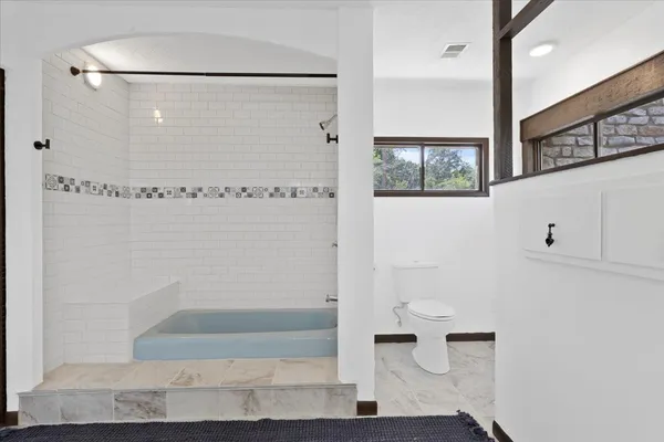 a bathroom with a sink and a bathtub