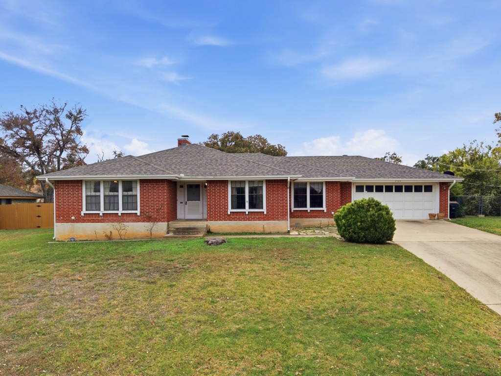 front view of a house with a yard
