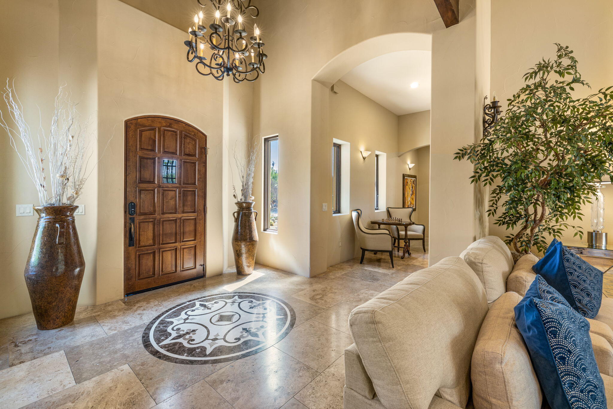 72033 Clancy Lane Rancho Mirage, CA 92270 - Photo 21 of 83 a living room with furniture a chandelier and a rug