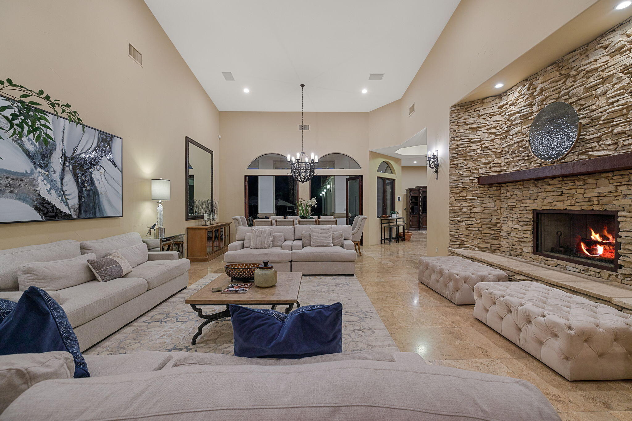 72033 Clancy Lane Rancho Mirage, CA 92270 - Photo 23 of 83 a living room with furniture a fireplace and a flat screen tv