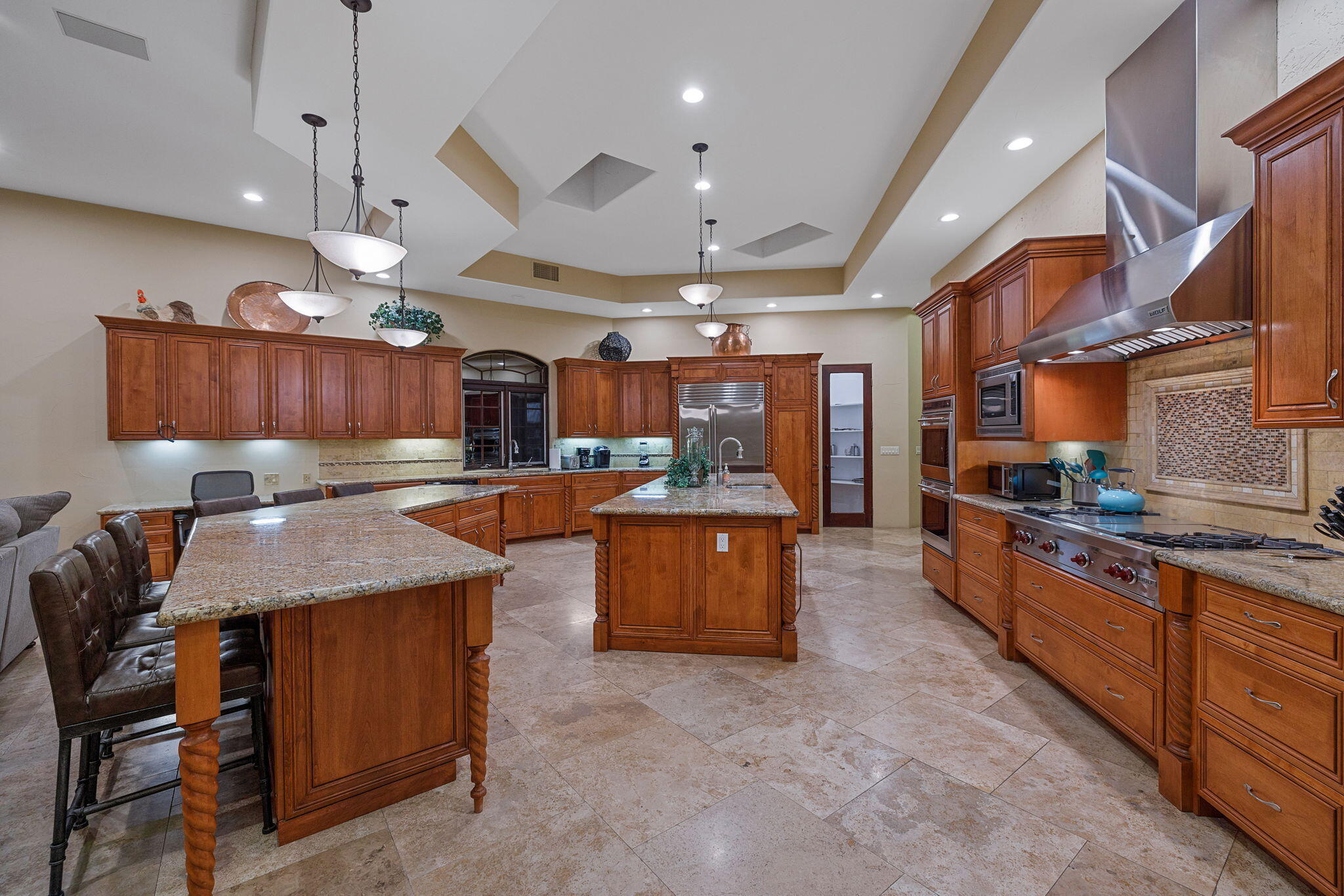 72033 Clancy Lane Rancho Mirage, CA 92270 - Photo 31 of 83 a large kitchen with a table and chairs