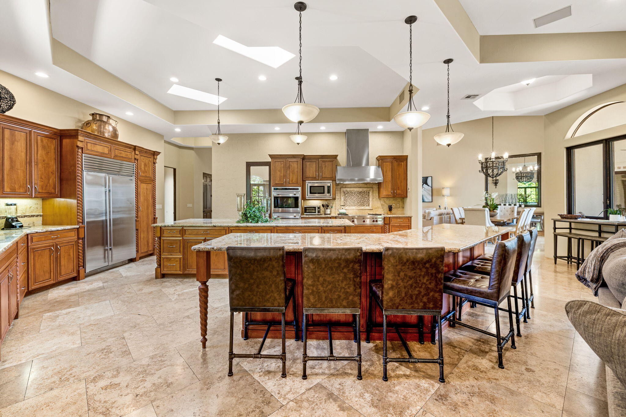 72033 Clancy Lane Rancho Mirage, CA 92270 - Photo 33 of 83 a large kitchen with a table and chairs