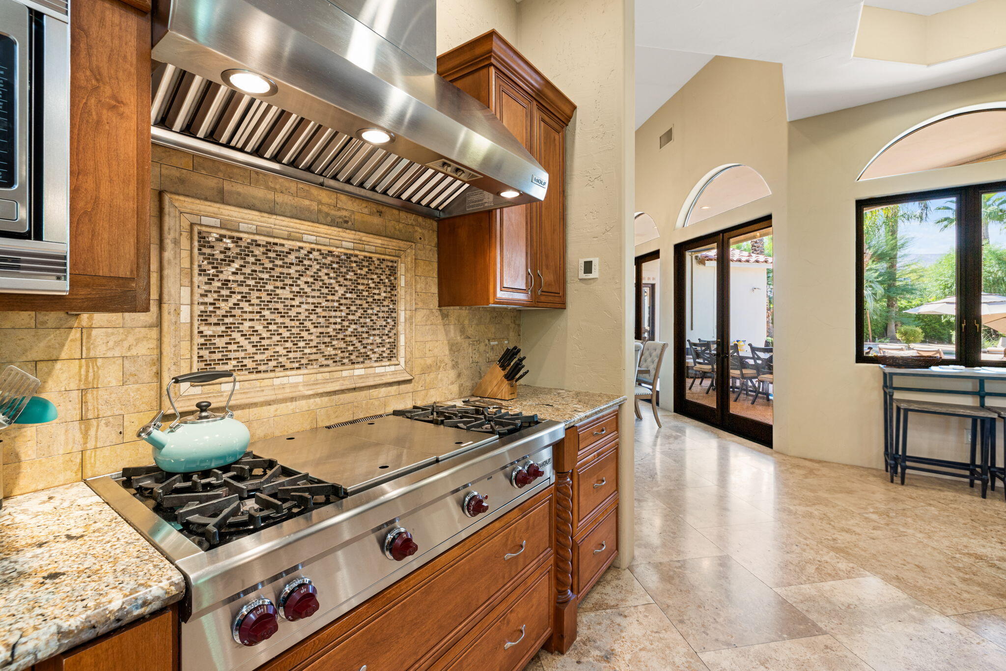 72033 Clancy Lane Rancho Mirage, CA 92270 - Photo 36 of 83 a kitchen with stainless steel appliances granite countertop a stove and a sink