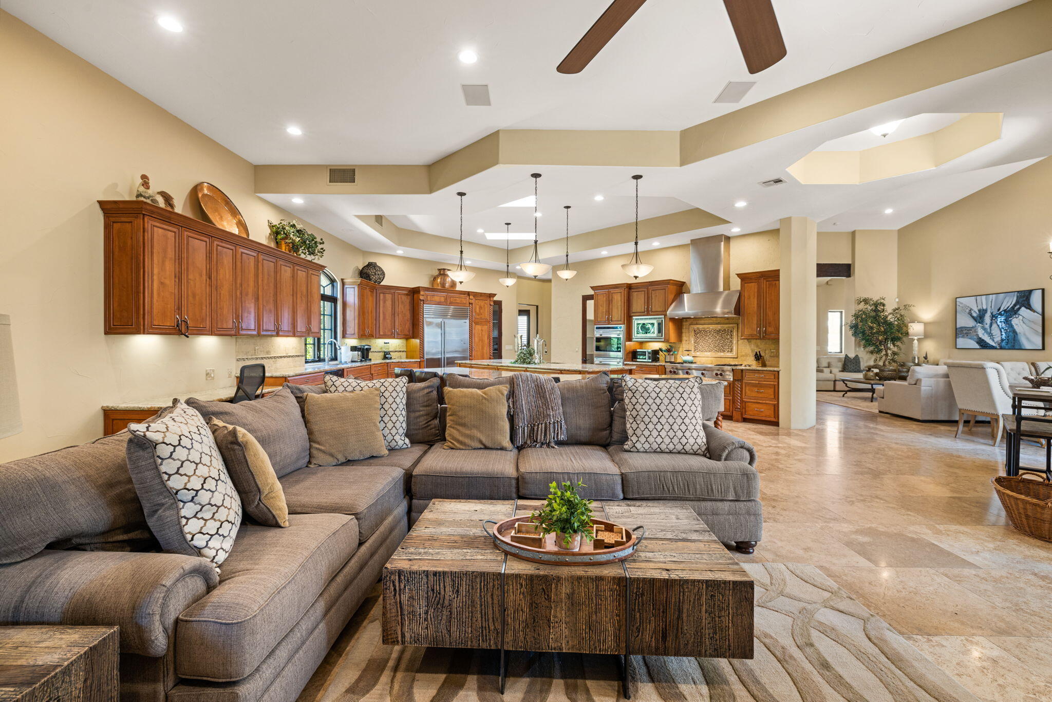 72033 Clancy Lane Rancho Mirage, CA 92270 - Photo 37 of 83 a living room with furniture kitchen view and a chandelier