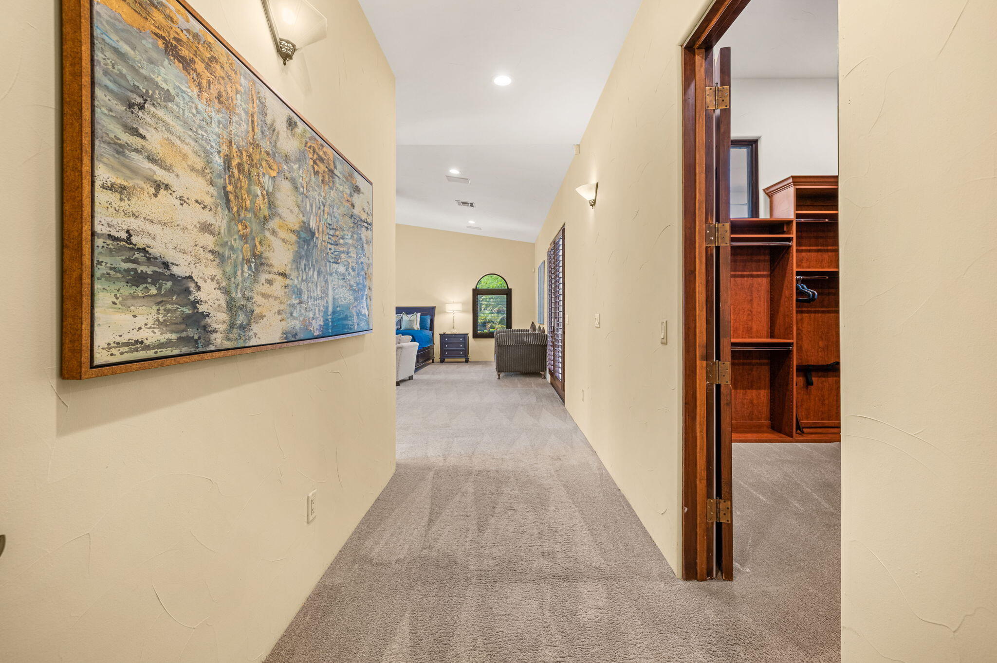 72033 Clancy Lane Rancho Mirage, CA 92270 - Photo 41 of 83 a view of a hallway with wooden floor and staircase