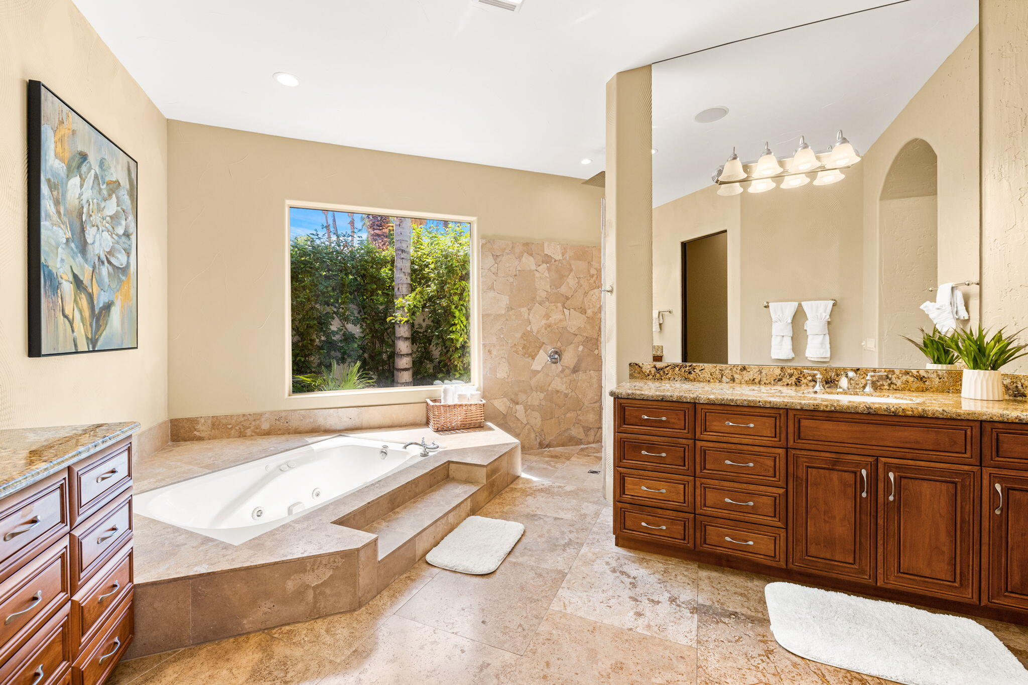 72033 Clancy Lane Rancho Mirage, CA 92270 - Photo 46 of 83 a spacious bathroom with a granite countertop tub and a large mirror