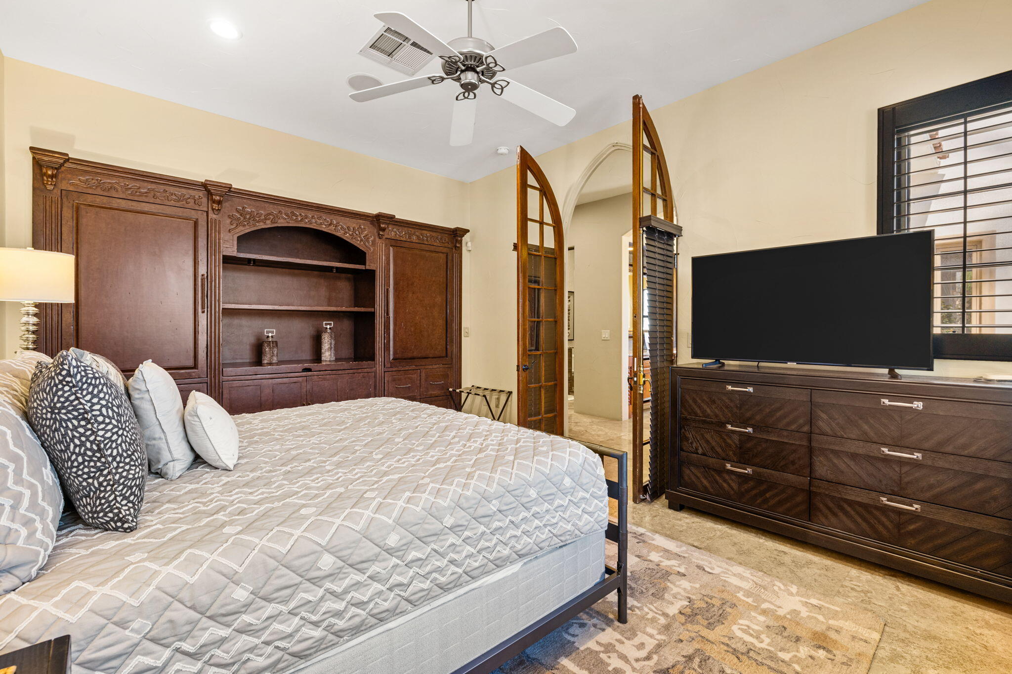 72033 Clancy Lane Rancho Mirage, CA 92270 - Photo 50 of 83 a bedroom with a bed and a flat screen tv