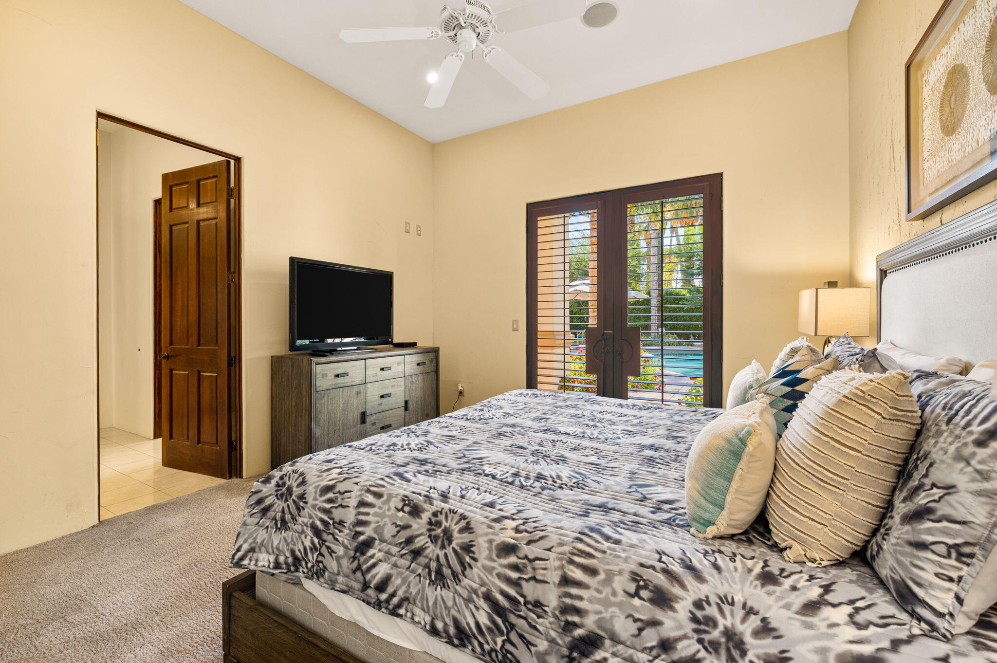 72033 Clancy Lane Rancho Mirage, CA 92270 - Photo 55 of 83 a bedroom with a bed and a flat tv screen on dresser
