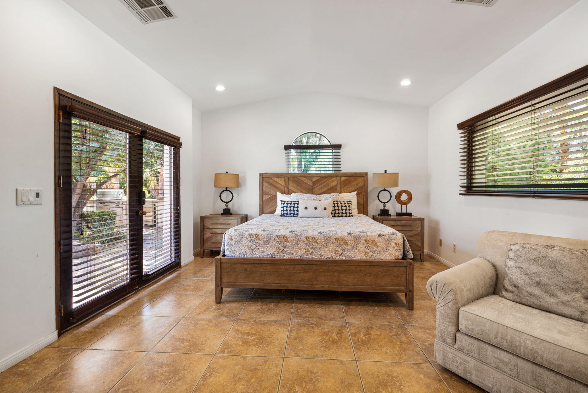72033 Clancy Lane Rancho Mirage, CA 92270 - Photo 64 of 83 a bedroom with a large bed and a couch