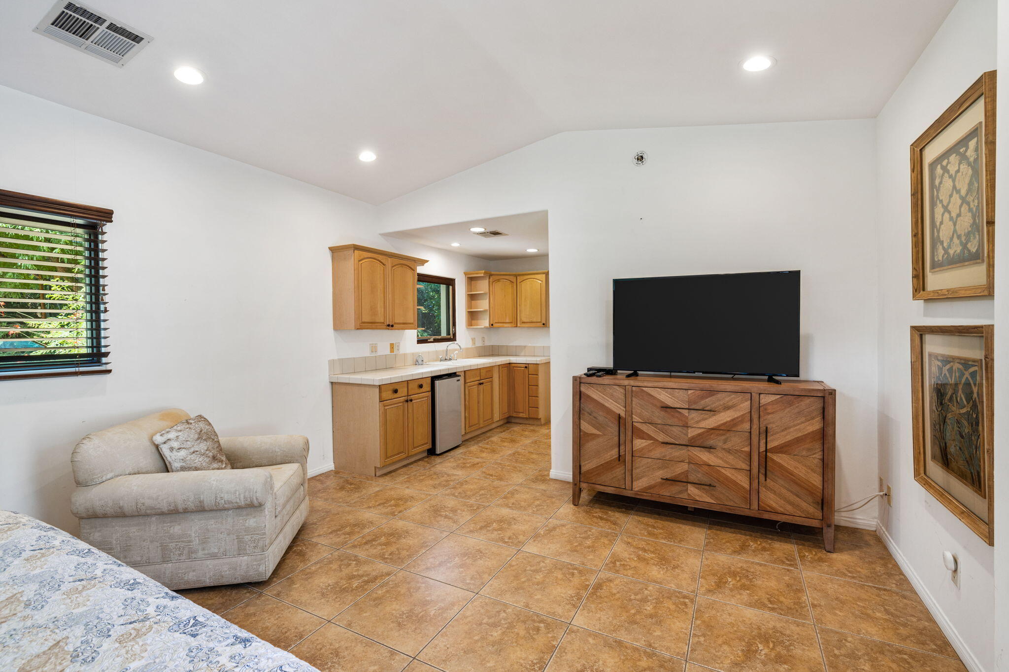 72033 Clancy Lane Rancho Mirage, CA 92270 - Photo 65 of 83 a living room with furniture and a flat screen tv