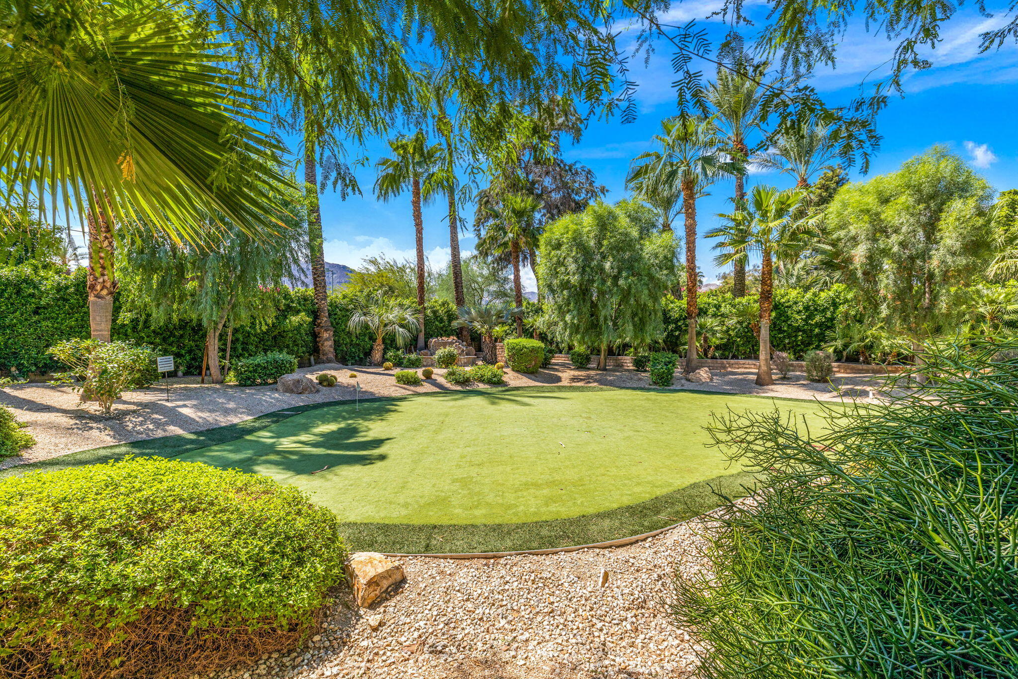 72033 Clancy Lane Rancho Mirage, CA 92270 - Photo 69 of 83 a view of a swimming pool with an outdoor space and seating area