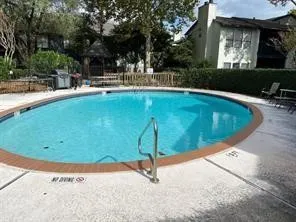 a view of a kitchen with a sink and cabinets