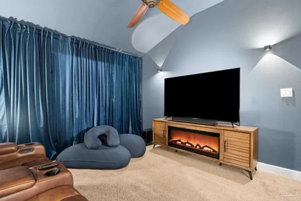 a bedroom with a bed and a lamp