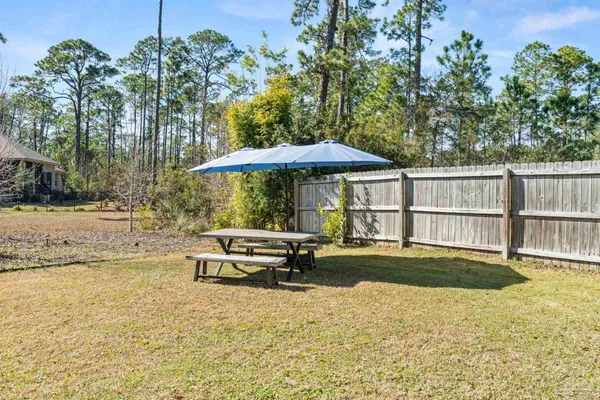 a view of a swimming pool with an outdoor seating