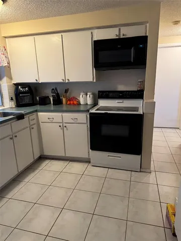 a dining room with furniture and a window
