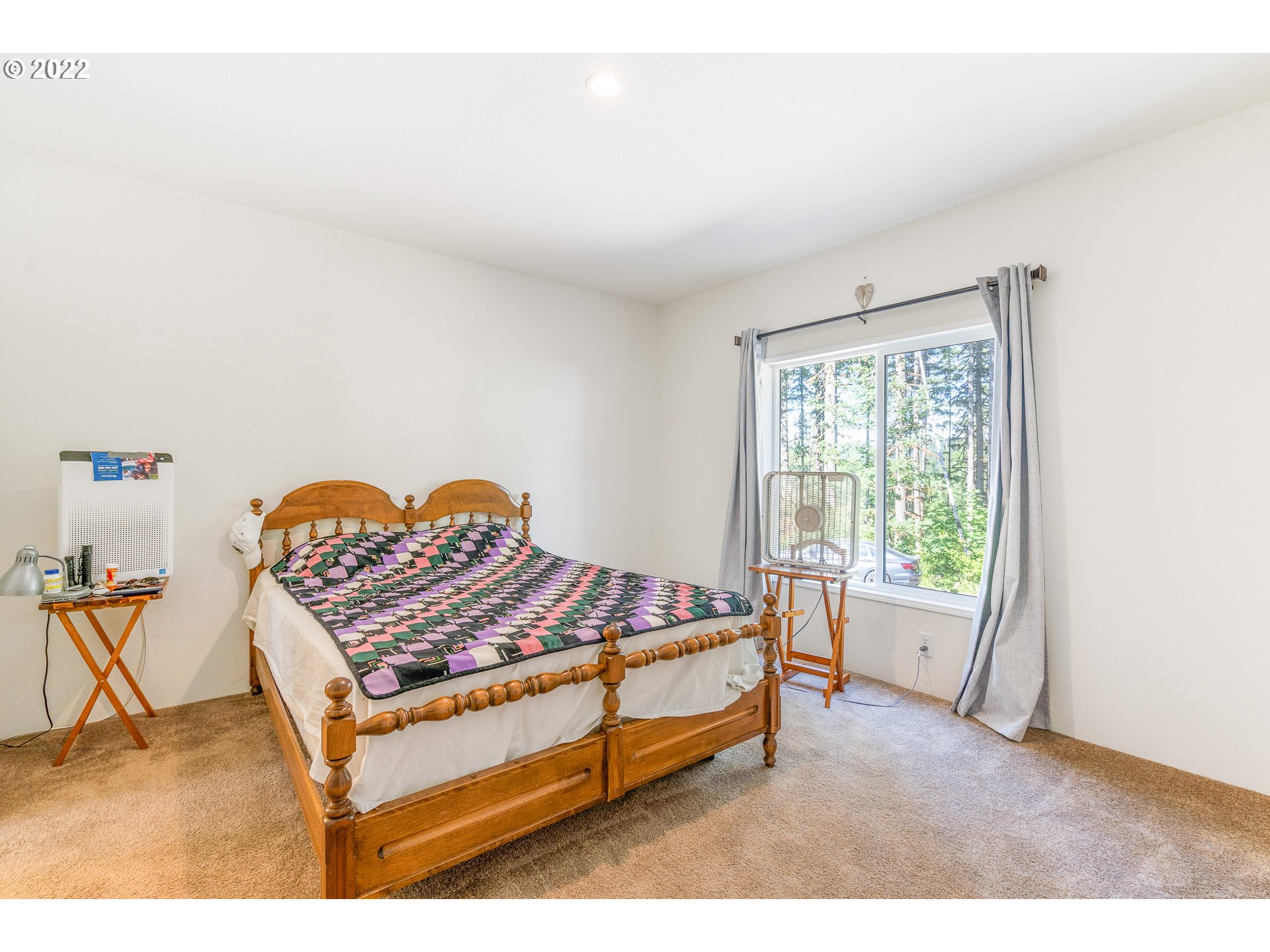 37220 Tree Farm Road Springfield, OR 97478 - Photo 11 of 32 a bed sitting in a bedroom next to a window