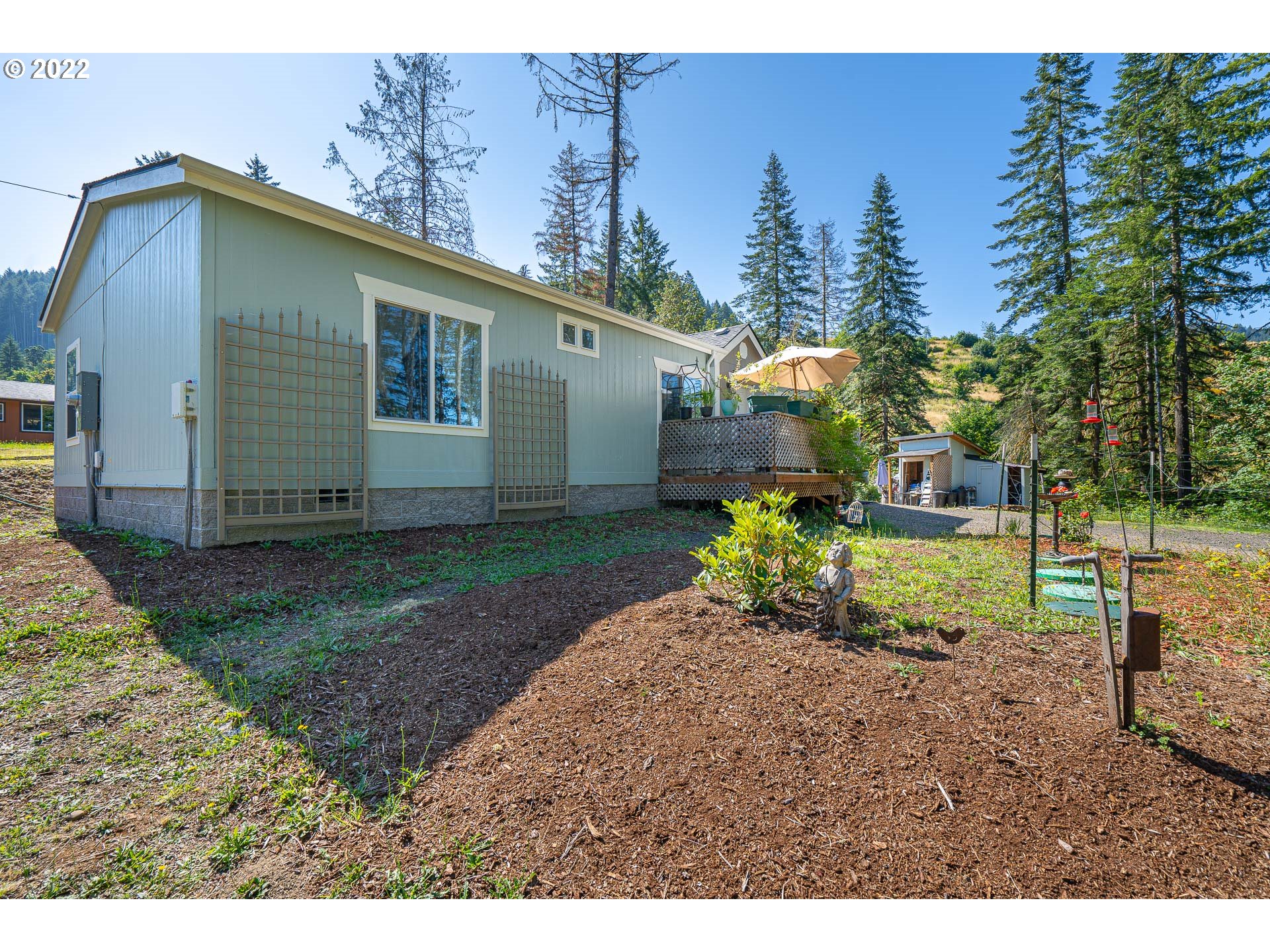 37220 Tree Farm Road Springfield, OR 97478 - Photo 25 of 32 a backyard of a house with table and chairs