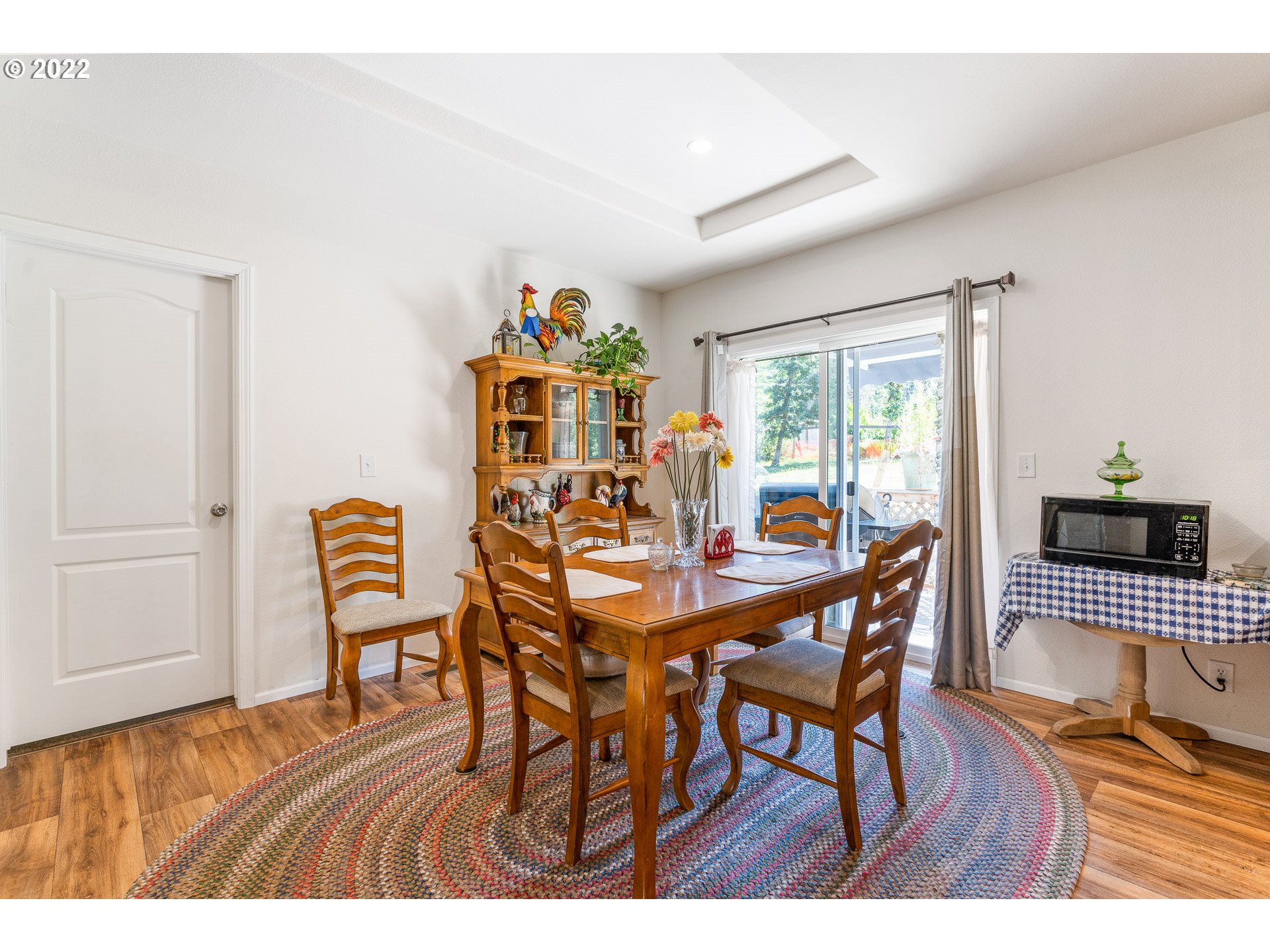 37220 Tree Farm Road Springfield, OR 97478 - Photo 9 of 32 a view of a dining room with furniture and wooden floor