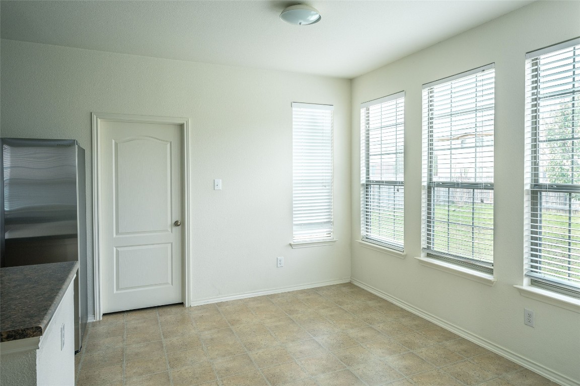 612 Dark Tree Lane Round Rock, TX 78664 - Photo 11 of 40 a view of an empty room with a window