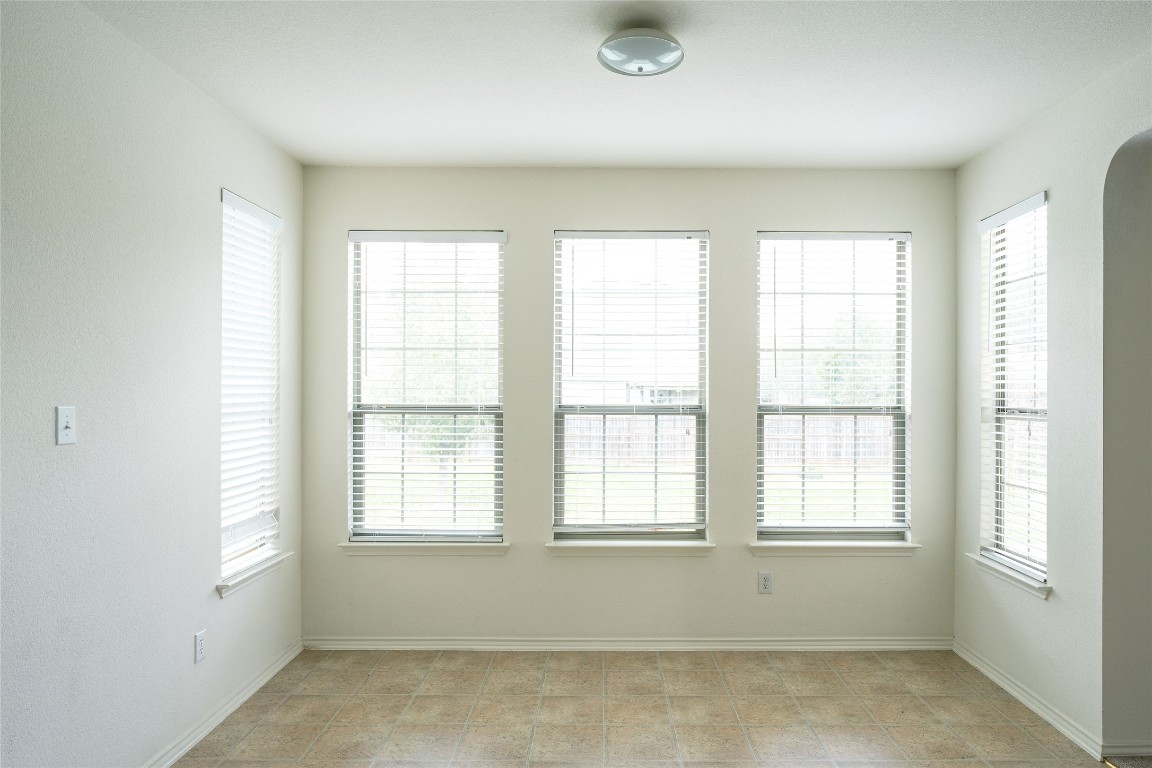 612 Dark Tree Lane Round Rock, TX 78664 - Photo 12 of 40 a view of an empty room with a window