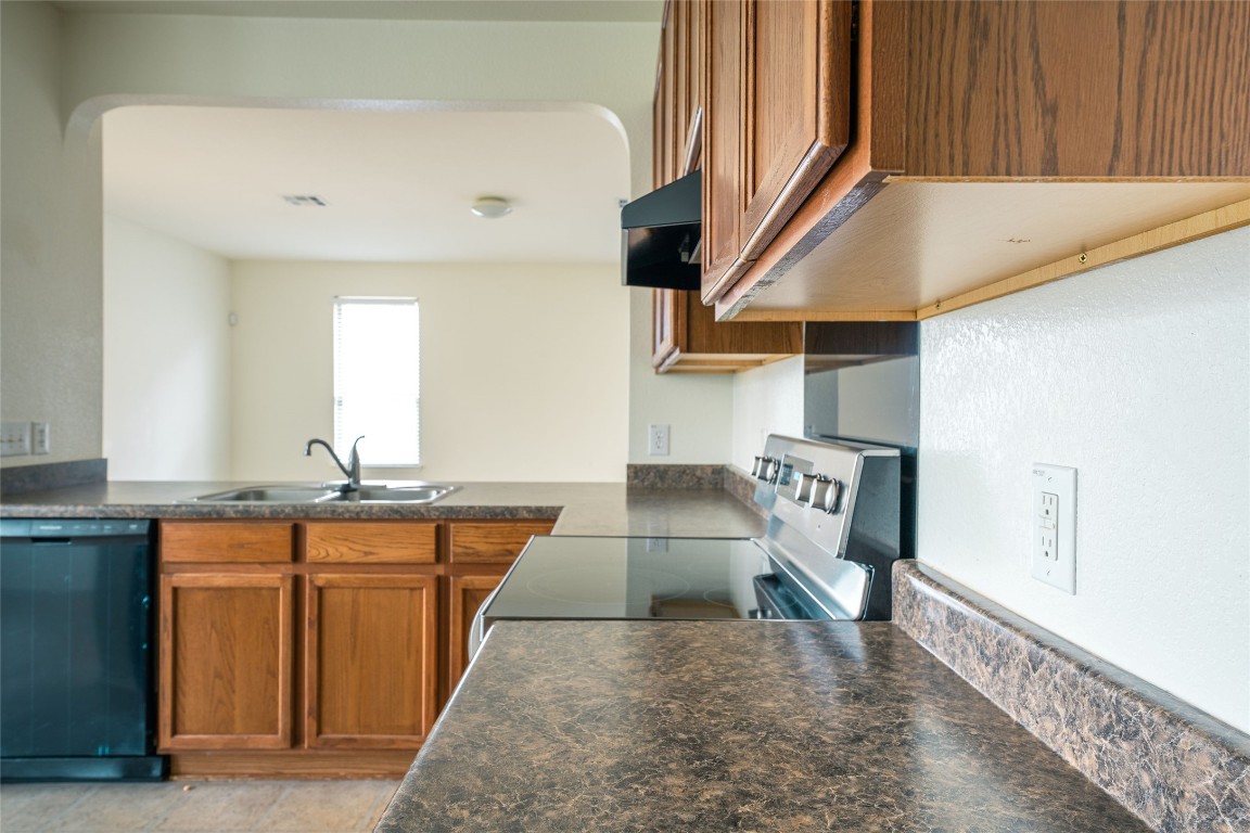 612 Dark Tree Lane Round Rock, TX 78664 - Photo 15 of 40 a view of a kitchen with furniture and staircase