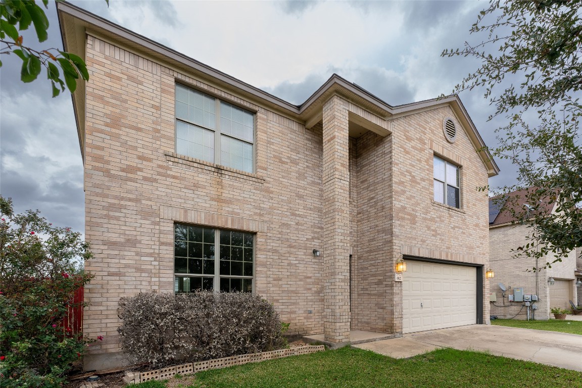 612 Dark Tree Lane Round Rock, TX 78664 - Photo 2 of 40 a front view of a house with a yard and garage