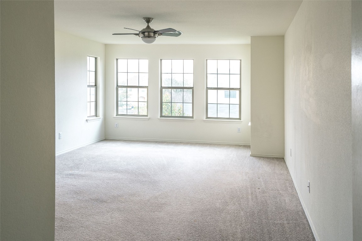 612 Dark Tree Lane Round Rock, TX 78664 - Photo 27 of 40 an empty room with a empty space and windows